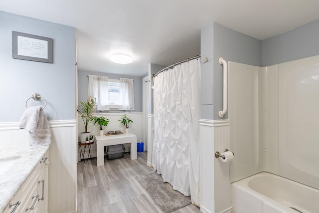 129 Indigo Hill Rd, Somersworth, NH 03878 - full bath with vanity, wood finished floors, wainscoting, and shower / bath combo