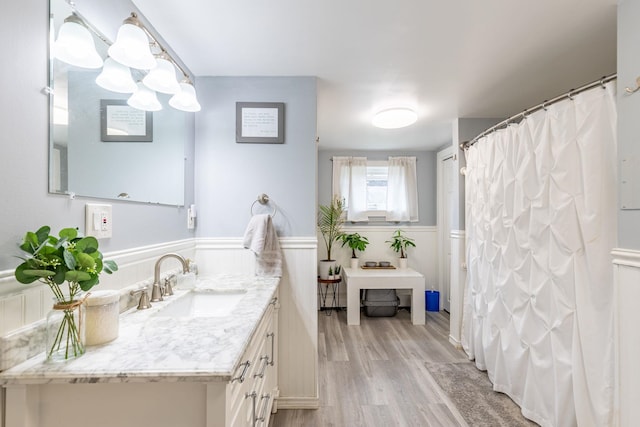 129 Indigo Hill Rd, Somersworth, NH 03878 - bathroom featuring wood finished floors, vanity, wainscoting, a chandelier, and curtained shower