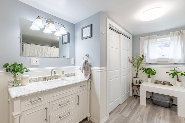 129 Indigo Hill Rd, Somersworth, NH 03878 - full bath with vanity, wainscoting, and wood finished floors