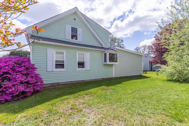 129 Indigo Hill Rd, Somersworth, NH 03878 - rear view of property featuring a lawn