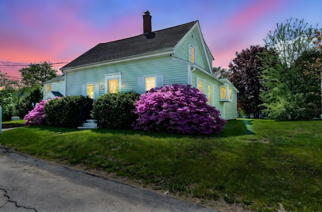 129 Indigo Hill Rd, Somersworth, NH 03878 - view of side of property featuring a chimney and a yard