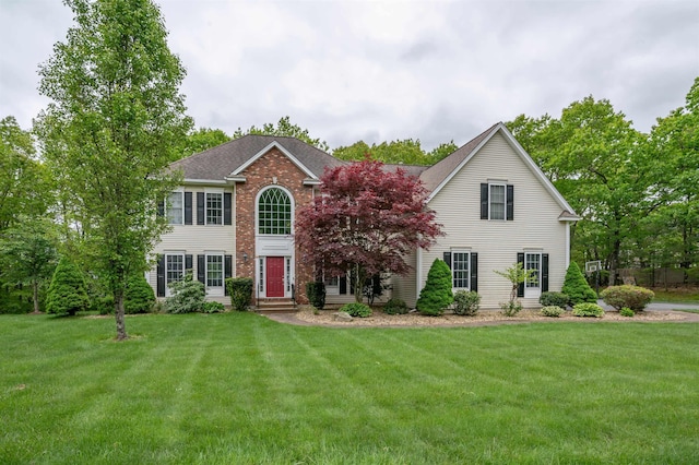 35 Northland Rd, Windham, NH 03087 - colonial inspired home with a front yard, brick siding, and a shingled roof