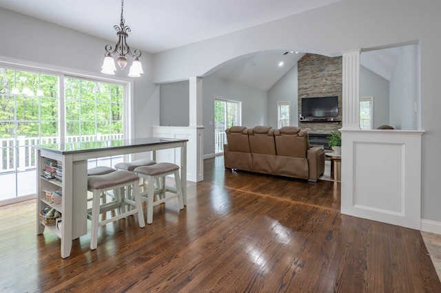 35 Northland Rd, Windham, NH 03087 - dining room featuring vaulted ceiling, arched walkways, dark wood-type flooring, baseboards, and a chandelier