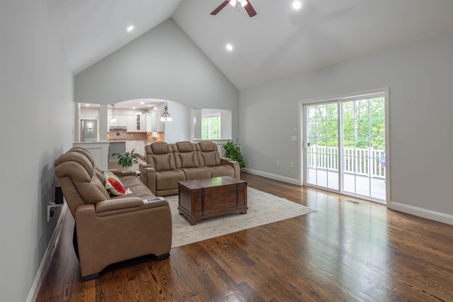 35 Northland Rd, Windham, NH 03087 - living area featuring high vaulted ceiling, a ceiling fan, ornate columns, healthy amount of natural light, and dark wood-style flooring