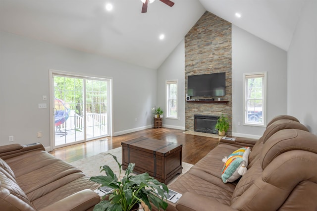 35 Northland Rd, Windham, NH 03087 - living area featuring plenty of natural light, light wood-type flooring, ceiling fan, high vaulted ceiling, and a stone fireplace