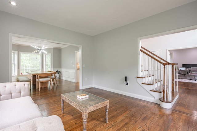35 Northland Rd, Windham, NH 03087 - living area with a chandelier, wood finished floors, stairs, wainscoting, and a decorative wall