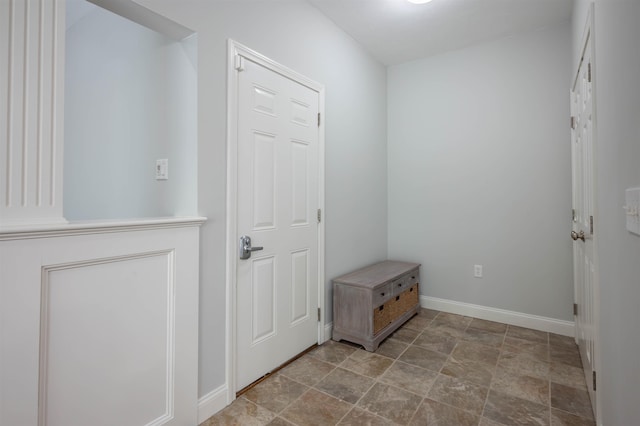 35 Northland Rd, Windham, NH 03087 - doorway with baseboards and stone finish flooring