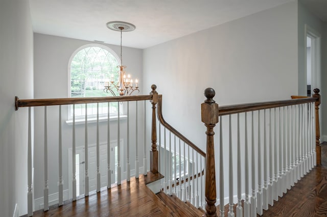 35 Northland Rd, Windham, NH 03087 - stairway with a chandelier, wood finished floors, and baseboards