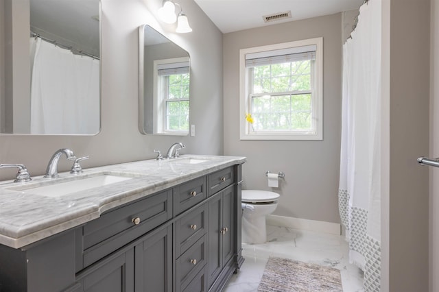 35 Northland Rd, Windham, NH 03087 - full bathroom with marble finish floors, double vanity, toilet, and baseboards