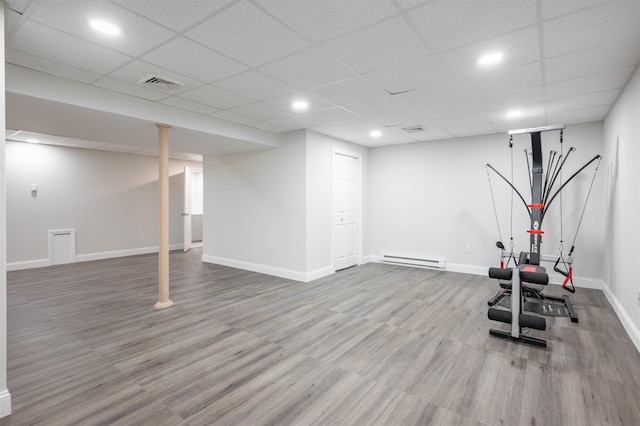 35 Northland Rd, Windham, NH 03087 - workout room with a baseboard heating unit, wood finished floors, baseboards, recessed lighting, and a paneled ceiling