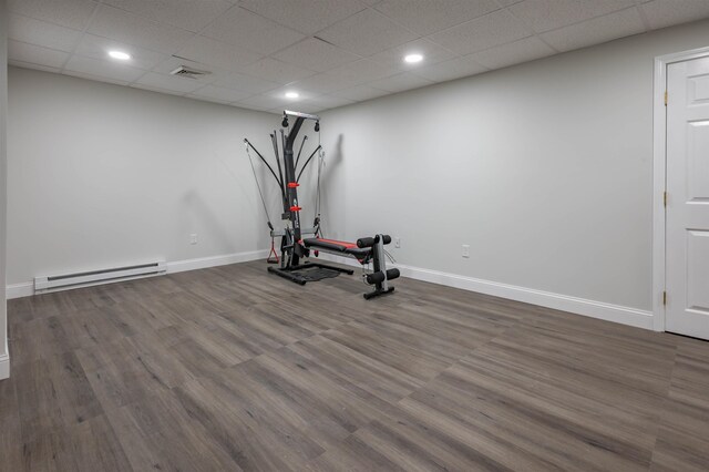 35 Northland Rd, Windham, NH 03087 - workout room featuring a baseboard radiator, baseboards, wood finished floors, recessed lighting, and a paneled ceiling