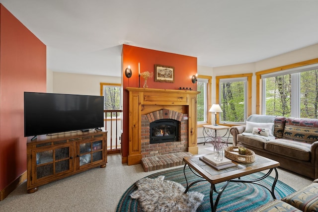 143 Bridge Rd Unit Vc331, Jay, VT 05859 - living area featuring healthy amount of natural light, a brick fireplace, and carpet flooring