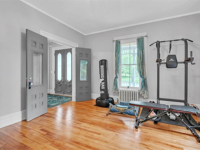 65 Congress St, Saint Albans City, VT 05478 - exercise area with radiator, wood finished floors, french doors, ornamental molding, and baseboards