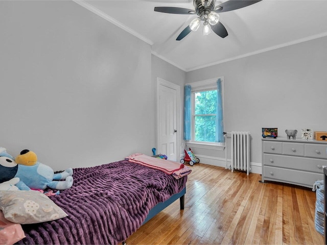 65 Congress St, Saint Albans City, VT 05478 - bedroom with radiator heating unit, ornamental molding, light wood-type flooring, a ceiling fan, and baseboards