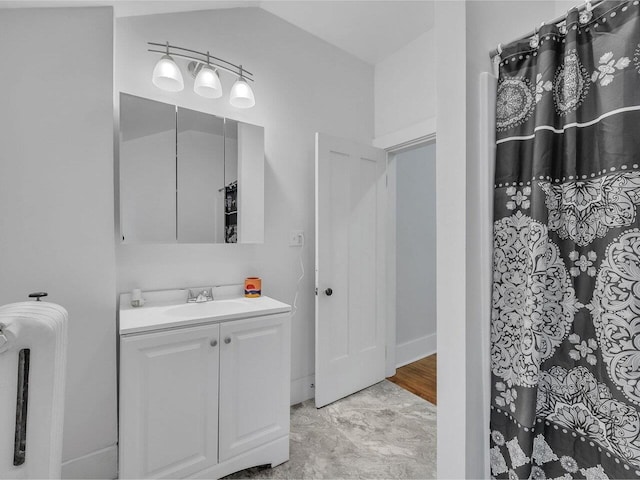 65 Congress St, Saint Albans City, VT 05478 - full bath featuring vanity, baseboards, and a shower with shower curtain