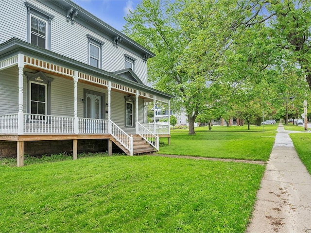 65 Congress St, Saint Albans City, VT 05478 - view of front of property featuring a porch and a front yard