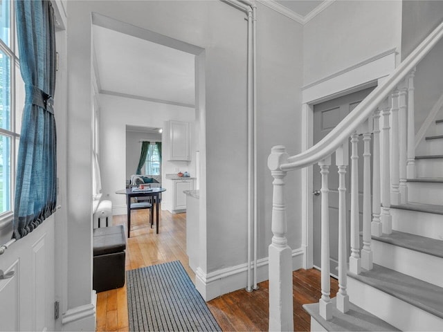 65 Congress St, Saint Albans City, VT 05478 - entrance foyer with ornamental molding, stairs, and light wood-type flooring