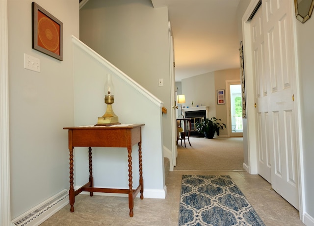 205 Mountain Rd, Concord, NH 03301 - carpeted entrance foyer featuring a baseboard heating unit, baseboards, and stairs