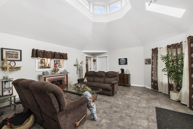 128 Fuller Dr, Canaan, VT 05903 - living area with high vaulted ceiling, a skylight, and a fireplace