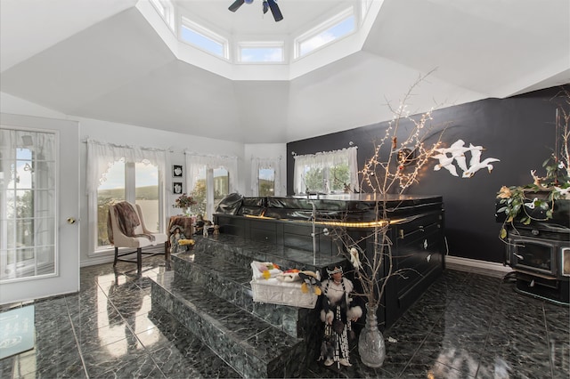 128 Fuller Dr, Canaan, VT 05903 - living room with marble tiled flooring, a ceiling fan, high vaulted ceiling, healthy amount of natural light, and a skylight
