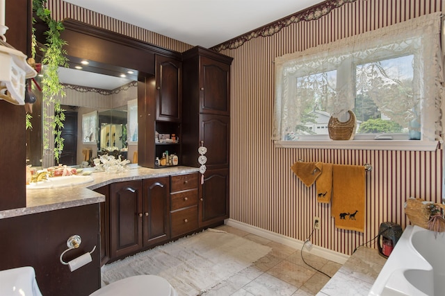 128 Fuller Dr, Canaan, VT 05903 - full bath with a garden tub, vanity, wallpapered walls, baseboards, and marble look tiles