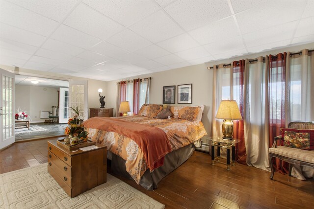 128 Fuller Dr, Canaan, VT 05903 - bedroom featuring a paneled ceiling and wood finished floors