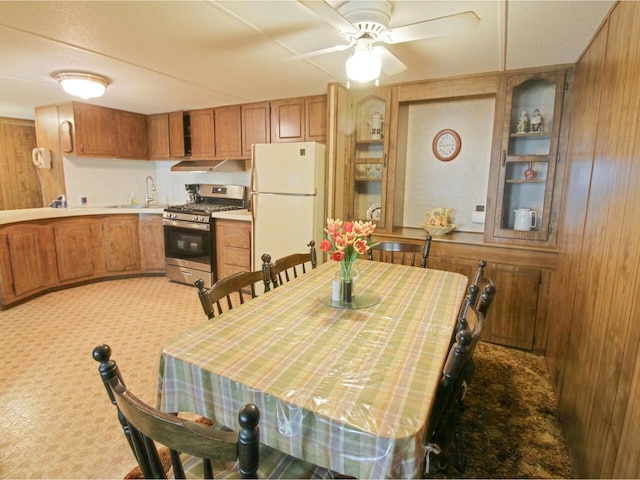244 Tranquility Ln, Saint Albans Town, VT 05478 - dining space with wooden walls, light carpet, and ceiling fan