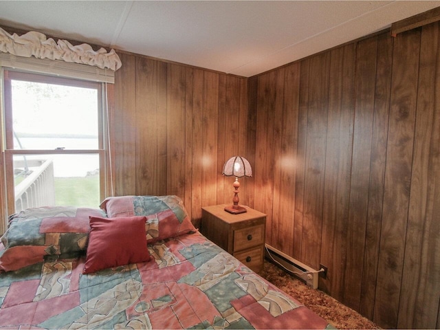 244 Tranquility Ln, Saint Albans Town, VT 05478 - bedroom with wooden walls and a baseboard radiator