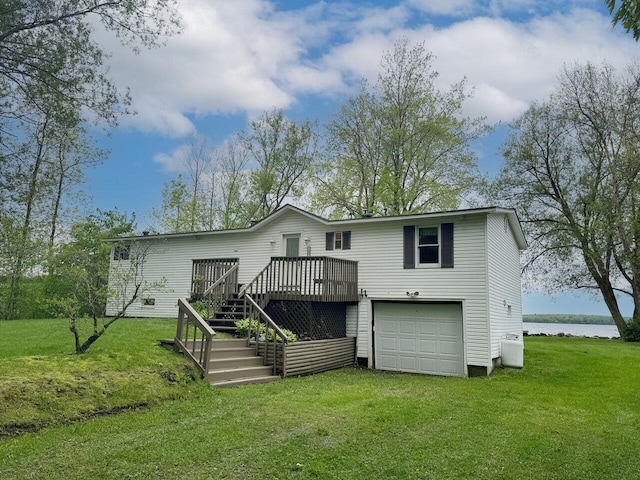244 Tranquility Ln, Saint Albans Town, VT 05478 - rear view of house featuring a wooden deck, stairs, an attached garage, and a lawn