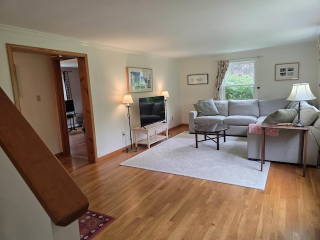 1073 Upper Dummerston Rd, Brattleboro, VT 05301 - living area featuring light wood-style flooring, crown molding, and baseboards