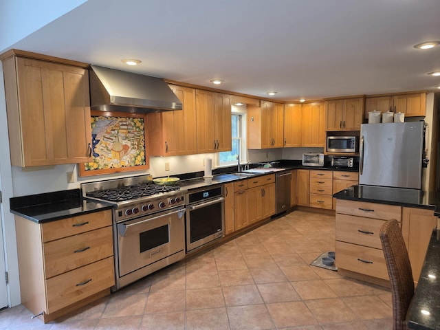 1073 Upper Dummerston Rd, Brattleboro, VT 05301 - kitchen featuring appliances with stainless steel finishes, wall chimney exhaust hood, recessed lighting, dark countertops, and light tile patterned floors