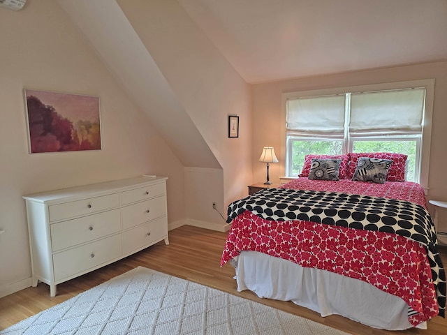 1073 Upper Dummerston Rd, Brattleboro, VT 05301 - bedroom featuring vaulted ceiling, wood finished floors, and baseboards