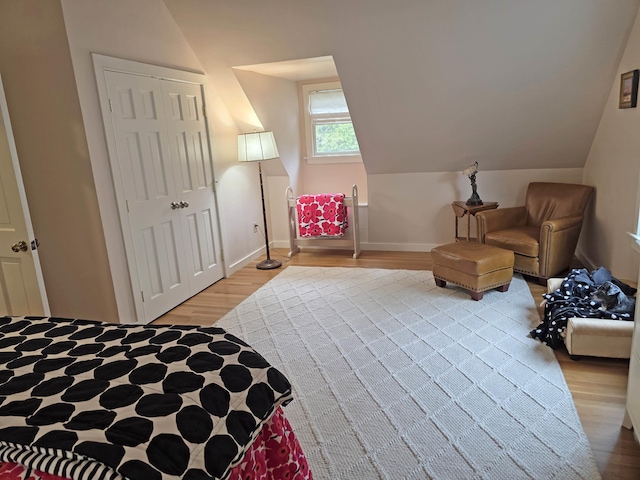 1073 Upper Dummerston Rd, Brattleboro, VT 05301 - bedroom with light wood finished floors, vaulted ceiling, and baseboards
