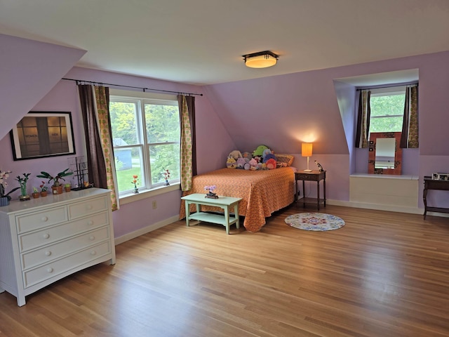 1073 Upper Dummerston Rd, Brattleboro, VT 05301 - bedroom featuring wood finished floors, baseboards, and vaulted ceiling