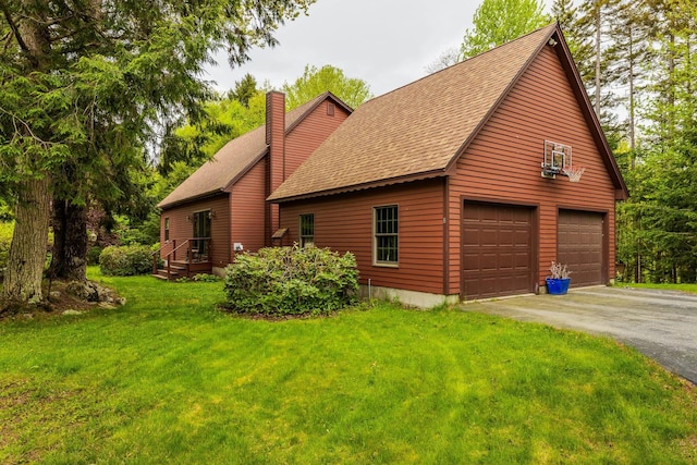 8 Mill Pond Rd, Grantham, NH 03753 - view of home's exterior with a chimney, a shingled roof, a lawn, and a garage