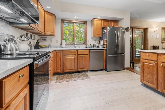 8 Mill Pond Rd, Grantham, NH 03753 - kitchen featuring stainless steel appliances, a sink, light countertops, brown cabinets, and recessed lighting