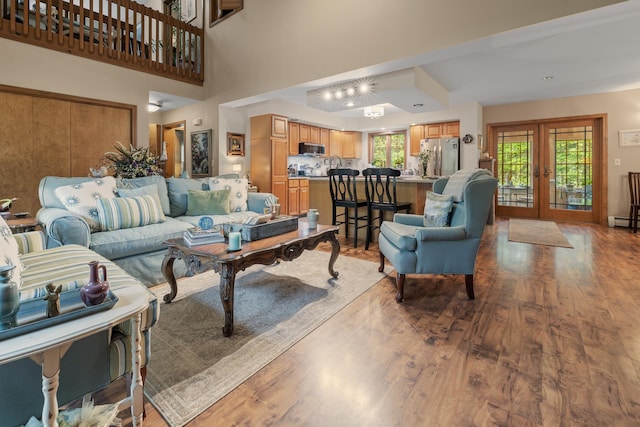8 Mill Pond Rd, Grantham, NH 03753 - living area featuring french doors and wood finished floors