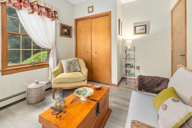 8 Mill Pond Rd, Grantham, NH 03753 - living area with a baseboard radiator, light wood finished floors, and baseboards