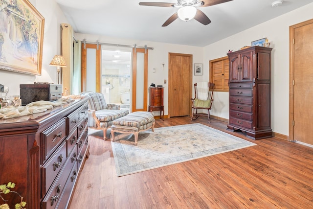 8 Mill Pond Rd, Grantham, NH 03753 - living area with a ceiling fan, wood finished floors, and baseboards