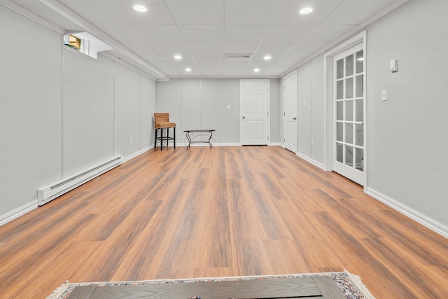 8 Mill Pond Rd, Grantham, NH 03753 - basement with a baseboard radiator, baseboards, wood finished floors, recessed lighting, and a drop ceiling
