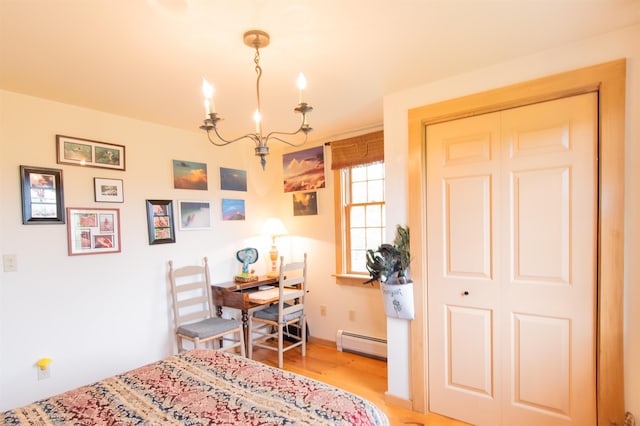 88 Kibling Hill Rd, Tunbridge, VT 05077 - bedroom with a baseboard heating unit, a chandelier, and light wood-type flooring