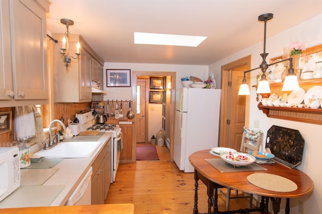 88 Kibling Hill Rd, Tunbridge, VT 05077 - kitchen featuring white appliances, a sink, a skylight, light wood-style floors, and under cabinet range hood