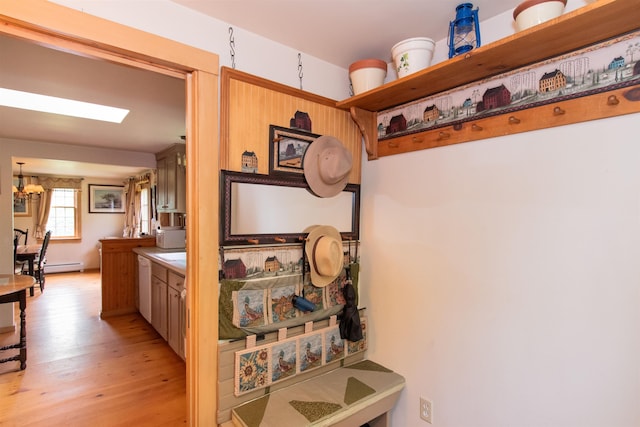 88 Kibling Hill Rd, Tunbridge, VT 05077 - corridor featuring light wood finished floors, a baseboard heating unit, and a chandelier
