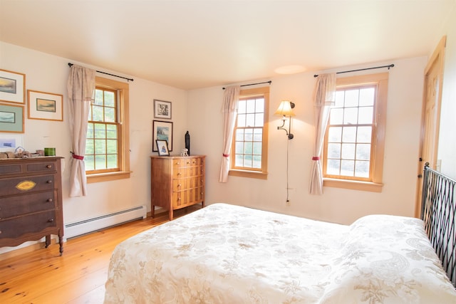 88 Kibling Hill Rd, Tunbridge, VT 05077 - bedroom with a baseboard heating unit and wood finished floors