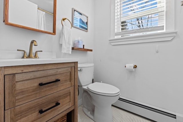 7 Lamson Ln, Hampton, NH 03842 - bathroom featuring a baseboard radiator, toilet, vanity, and baseboards