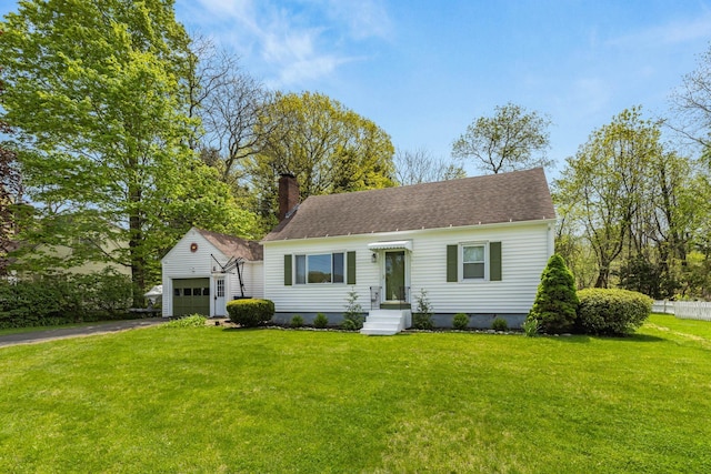7 Lamson Ln, Hampton, NH 03842 - new england style home featuring a chimney, driveway, an attached garage, a front lawn, and roof with shingles