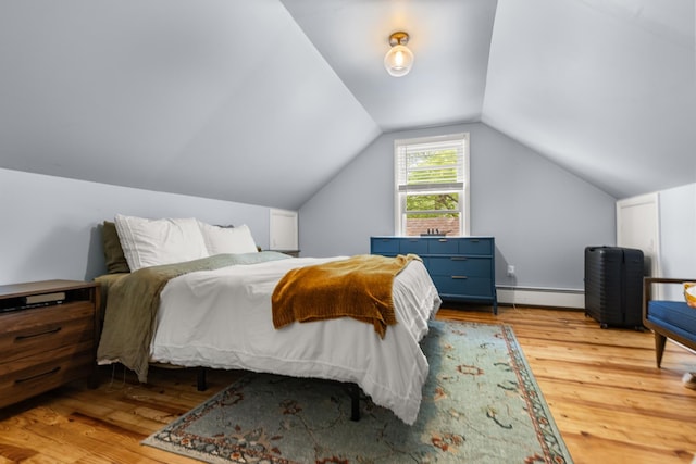 7 Lamson Ln, Hampton, NH 03842 - bedroom with a baseboard heating unit, wood finished floors, and vaulted ceiling