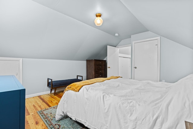 7 Lamson Ln, Hampton, NH 03842 - bedroom featuring wood finished floors, vaulted ceiling, and baseboards