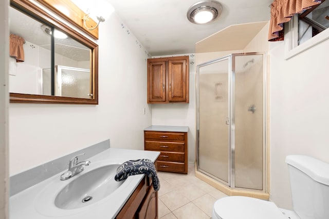 44 Weare Rd, Seabrook, NH 03874 - bathroom featuring a stall shower, vanity, toilet, and tile patterned flooring