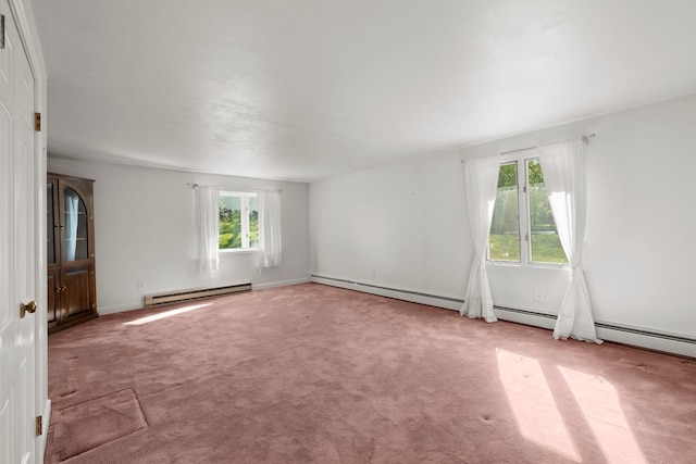 44 Weare Rd, Seabrook, NH 03874 - carpeted empty room featuring plenty of natural light, baseboard heating, and baseboards